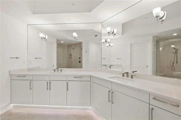 Master bath is spacious features under cabinet lights and dual sinks