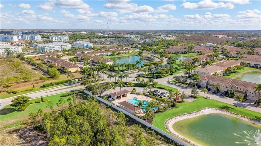 View of property location featuring a large body of water and nearby suburban area