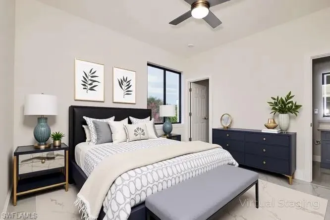 Bedroom featuring light marble finish flooring and ceiling fan