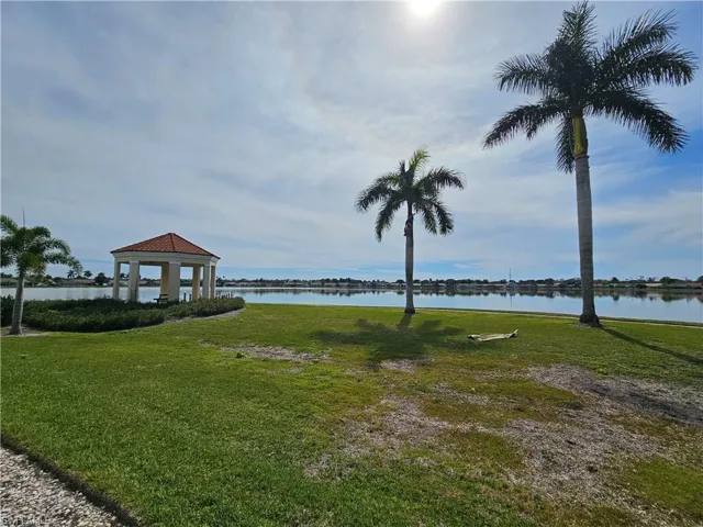 View of yard with a gazebo and a water view