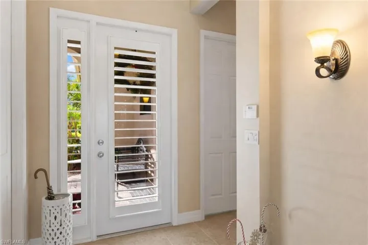 Entry features custom plantation style blinds