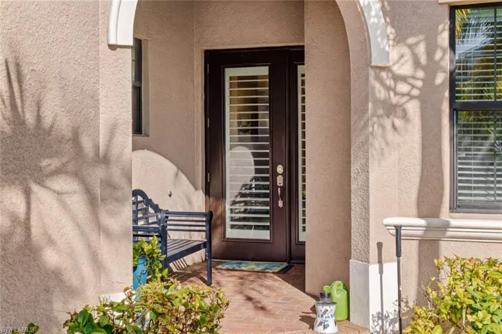Glass entry door, with sitting area at front porch