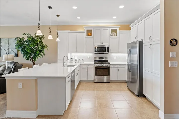 Check out the under cabinet lighting highlighting gorgeous tile backsplash