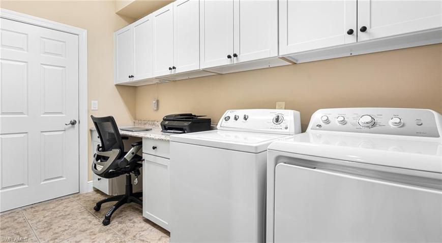 Large laundry with additional cabinets