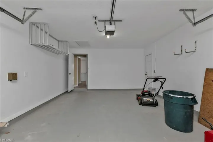Garage featuring a garage door opener