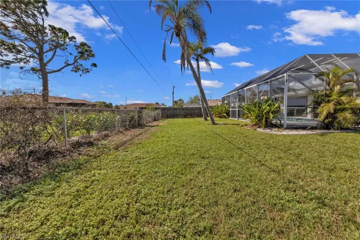 View of yard with a lanai