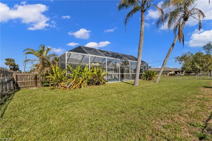 View of yard featuring a lanai