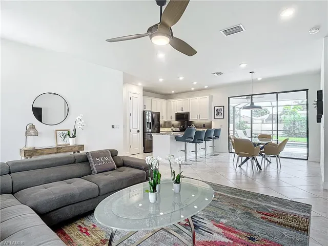 Tiled living room with ceiling fan