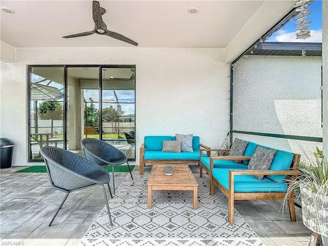 View of patio featuring an outdoor hangout area and ceiling fan