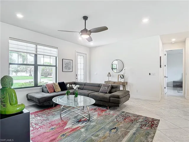 Tiled living room with ceiling fan