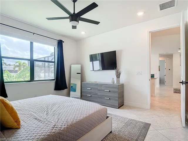 Bedroom featuring ceiling fan and light tile patterned floors