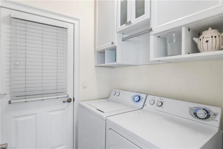 Laundry room has extra storage.