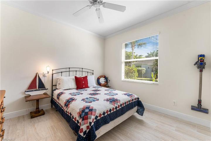 2nd bedroom has lots of natural light.  Crown molding.