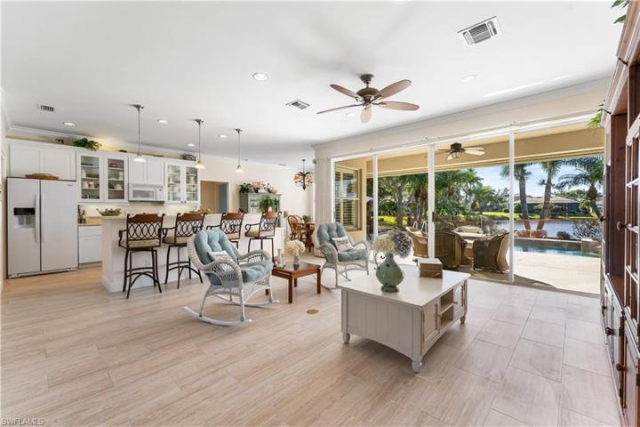 As you enter, you are drawn to the beautiful lake view through you wall of glass and your open floorplan! New plank tile flooring throughout the home!