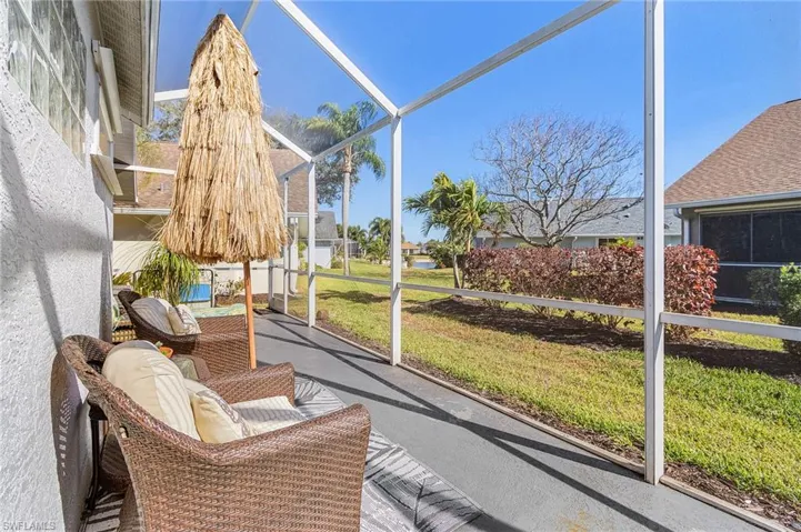 Sunroom featuring a patio