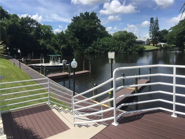 Dock area featuring a water view