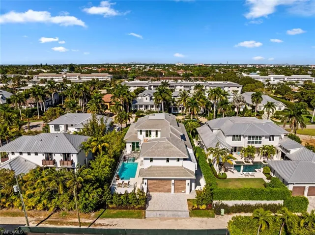 Aerial perspective of suburban area with a pool