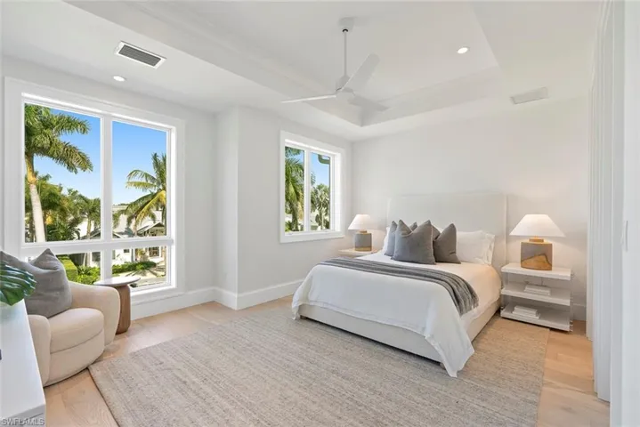 Bedroom featuring a ceiling fan, light wood finished floors, and recessed lighting