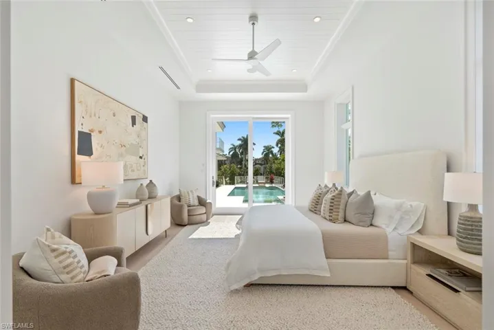 Bedroom featuring access to outside, ceiling fan, recessed lighting, and a raised ceiling