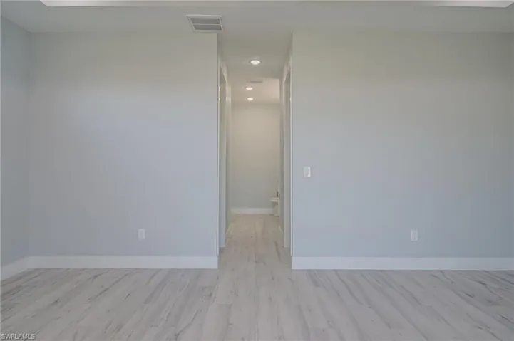 Empty room featuring light wood-type flooring