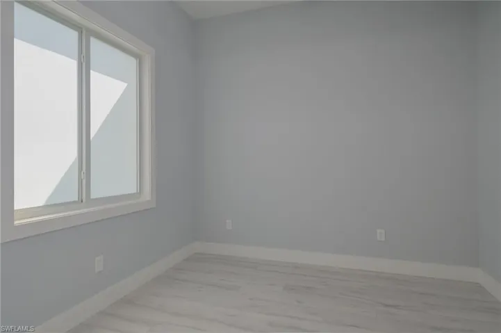 Empty room with light wood-type flooring