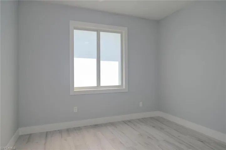 Spare room with light wood-type flooring