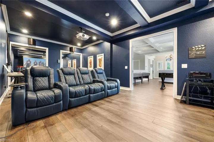 Bathroom featuring hardwood / wood-style flooring, vanity, and toilet