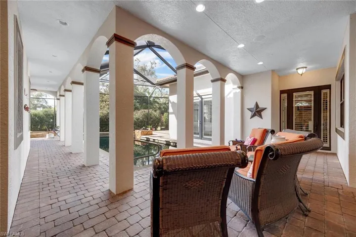 View of patio with glass enclosure