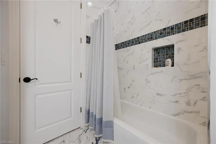 Bathroom featuring shower / bath combo