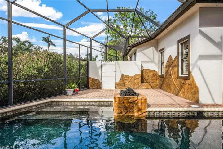 View of pool with a lanai