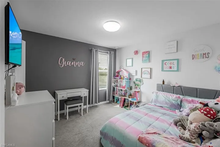 Bedroom with carpet floors and baseboards
