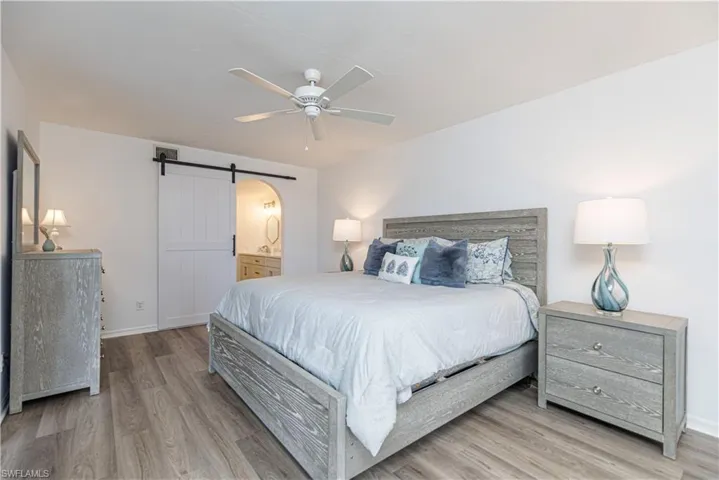 Primary bedroom with sliding door for privacy