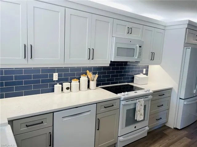 Beautiful quartz countertops and stunning backsplash