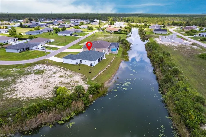 Aerial view of residential area with a large body of water