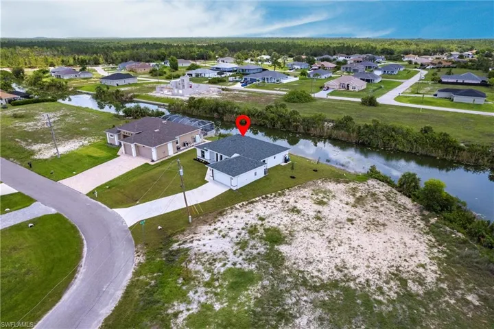 Aerial view of residential area with a nearby body of water