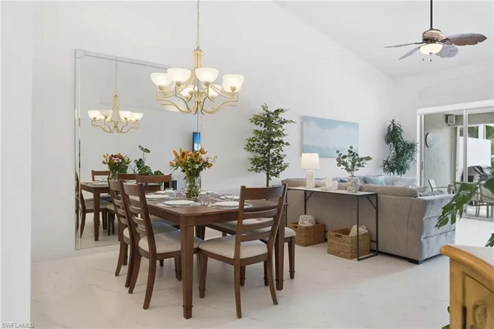 Bright dining area with white tile flooring