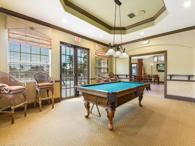 Game room featuring a billiard table, tray ceiling with recessed lighting, and wall-to-wall carpeting
