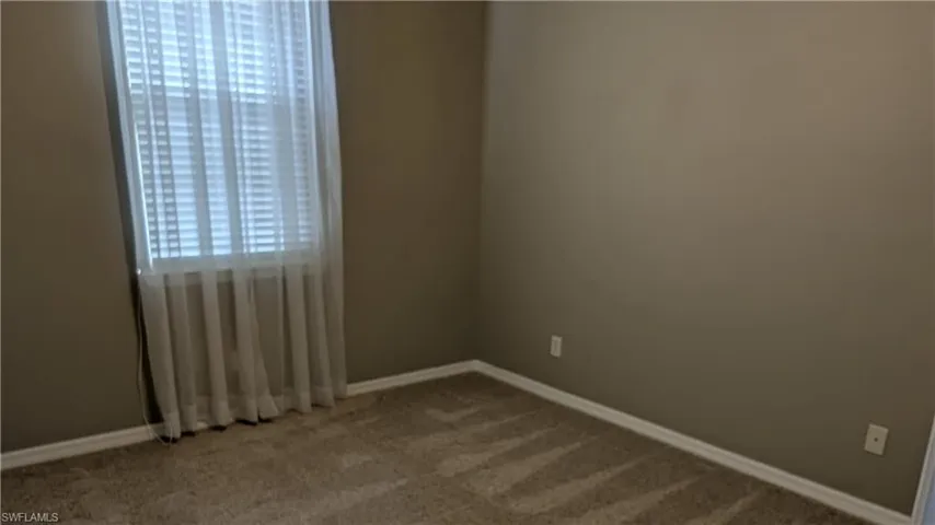 Spare room with plenty of natural light and carpet flooring