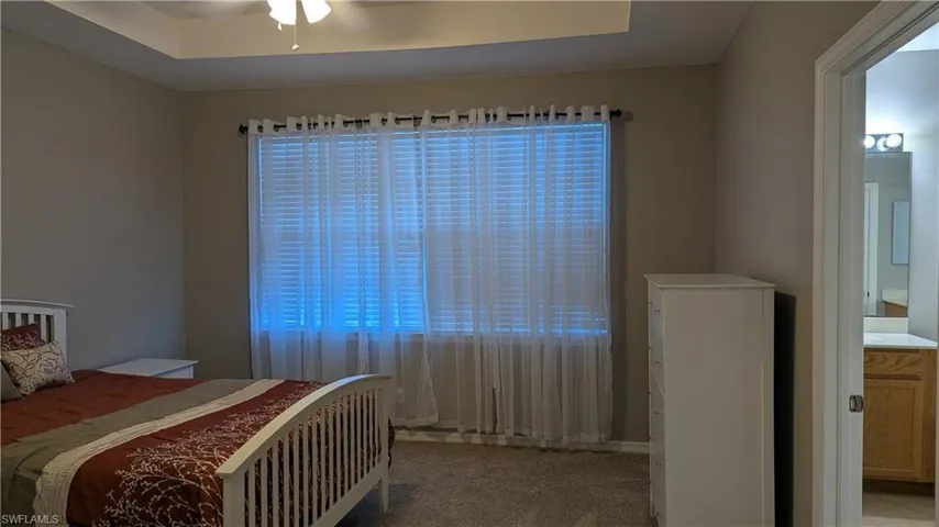 Bedroom with light carpet