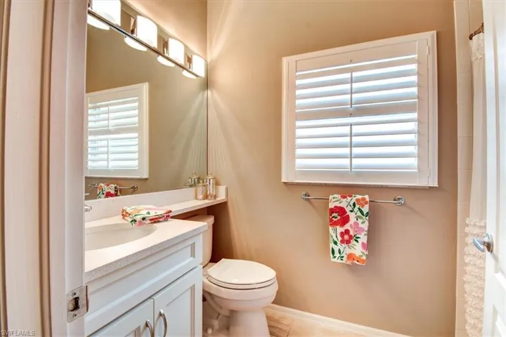 Bathroom featuring vanity and a shower with curtain