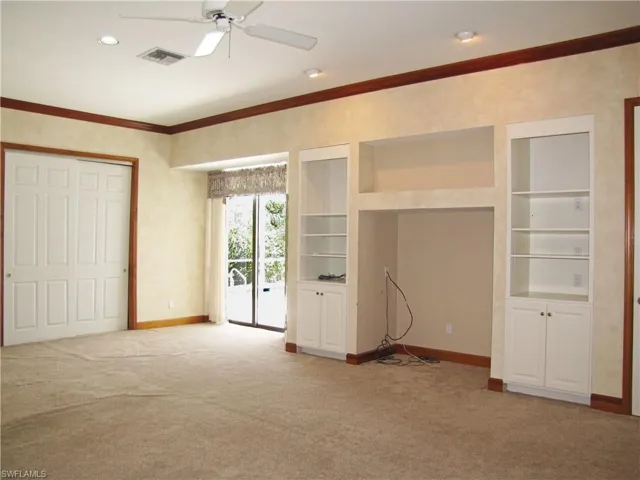 Multi-purpose flex room with sliders to pool area.