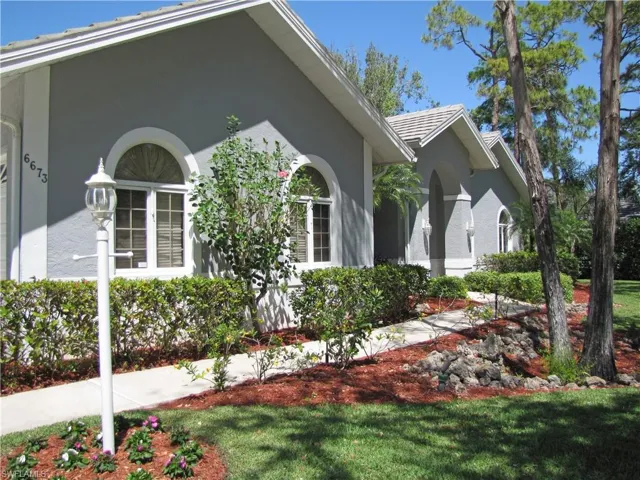 View of side of home with stucco siding