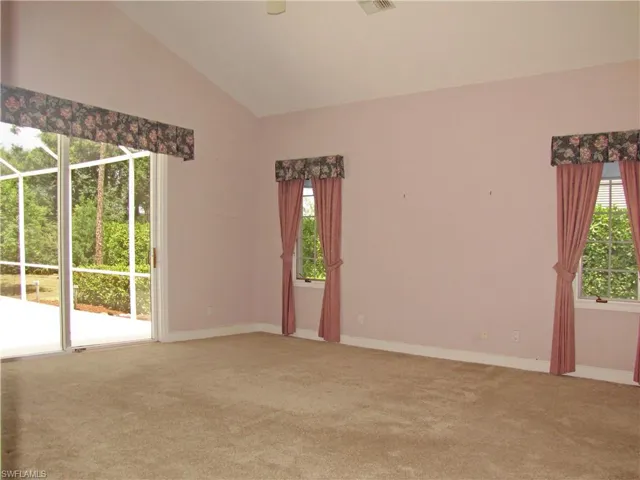 Bedroom with entry to pool area.