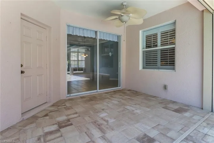 View of patio featuring ceiling fan