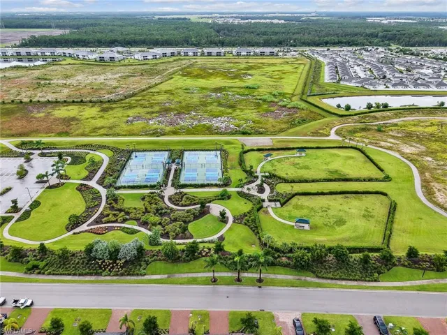Aerial perspective of suburban area featuring a large body of water