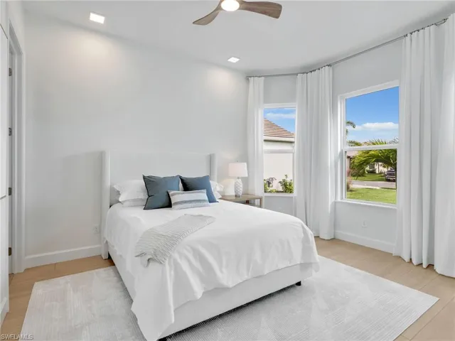 Bedroom featuring ceiling fan and light wood-style flooring