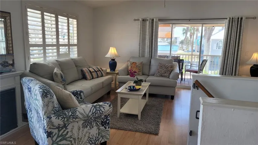 Living room with wood-type flooring