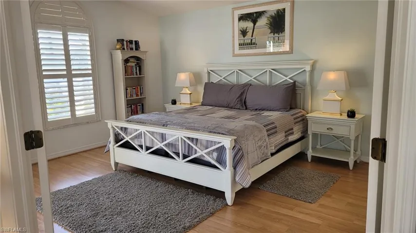 Bedroom with hardwood / wood-style floors