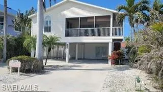 View of front of property with a carport