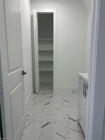Bathroom with tile flooring and vanity